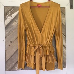 Mustard yellow cardigan with layered bottom detail